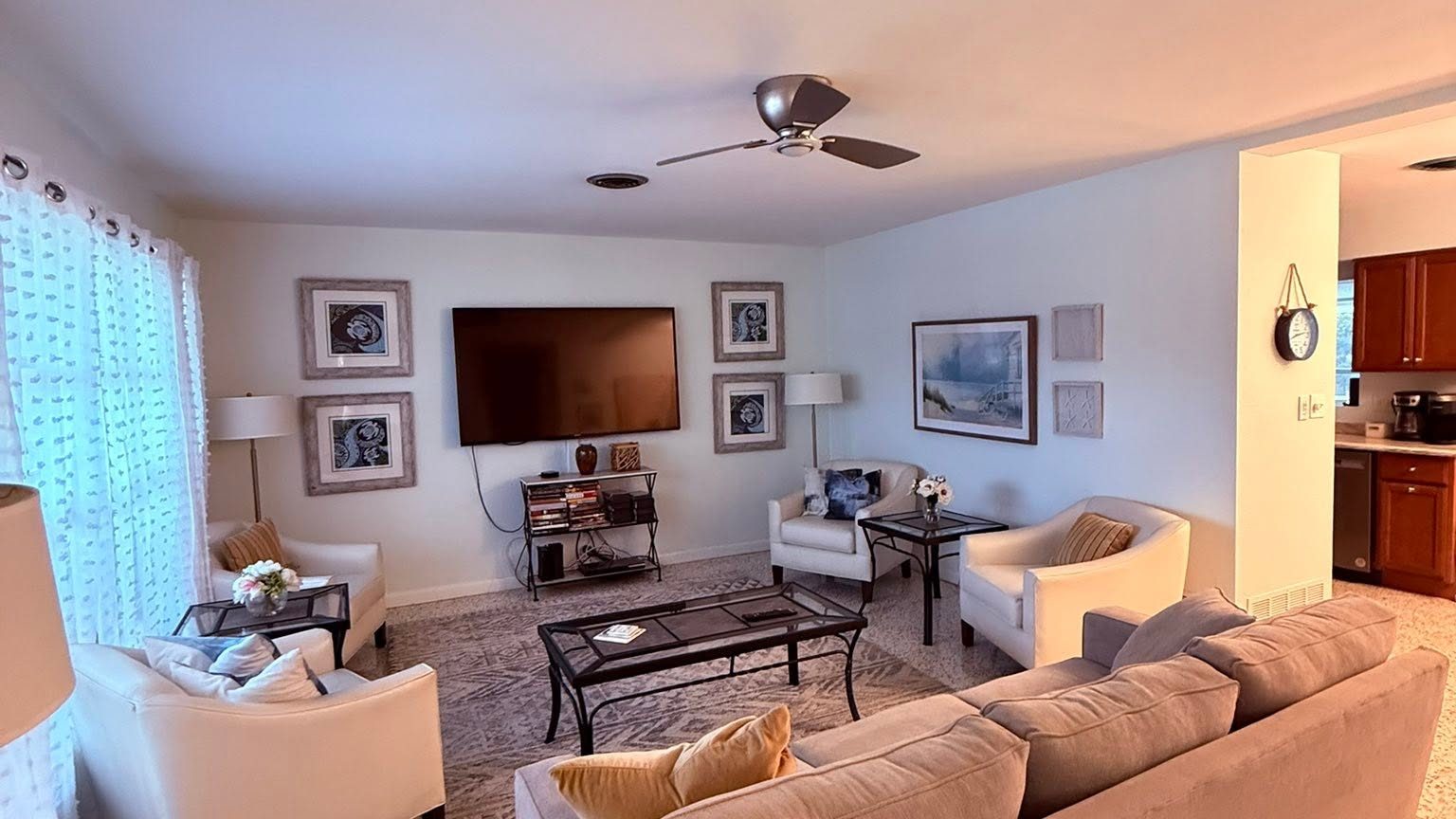 Freshly cleaned living room with a sectional sofa, coffee table and vacuumed carpet